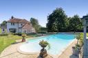 A £3 million house is on the market featuring a swimming pool, pool house and triple garage.