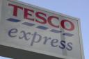 A man has been struck on the head with a wine bottle during an assault in a Tesco Express.