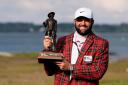 Scottie Scheffler holds the trophy after winning the RBC Heritage for his fourth win in five starts (Chris Carlson/AP)