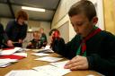 Cub scouts help deliver Christmas mail for elderly