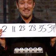 Derren Brown smiles as his prediction matches the actual lottery draw