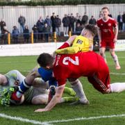 Joe Iaciofano gets caught in a goal-mouth scramble against Welling United. Picture: Leigh Page