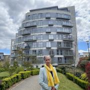 Daisy Cooper outside Opus House, Charrington Place in St Albans, which is affected by fire safety defects.