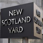 New Scotland Yard sign outside the headquarters of the Metropolitan Police. Credit: PA