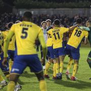 St Albans City players celebrate at the final whistle during the Emirates FA Cup first round match at Clarence Park, St Albans. Credit: PA