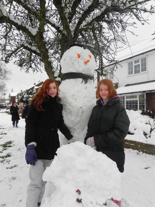 Ciara James and Clara Noden next to their new friend in Flinders Close. Photo sent in by Maria Larmer


