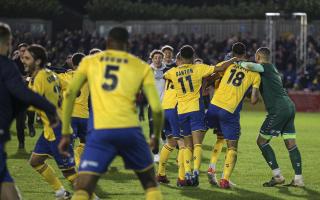 St Albans City players celebrate at the final whistle during the Emirates FA Cup first round match at Clarence Park, St Albans. Credit: PA