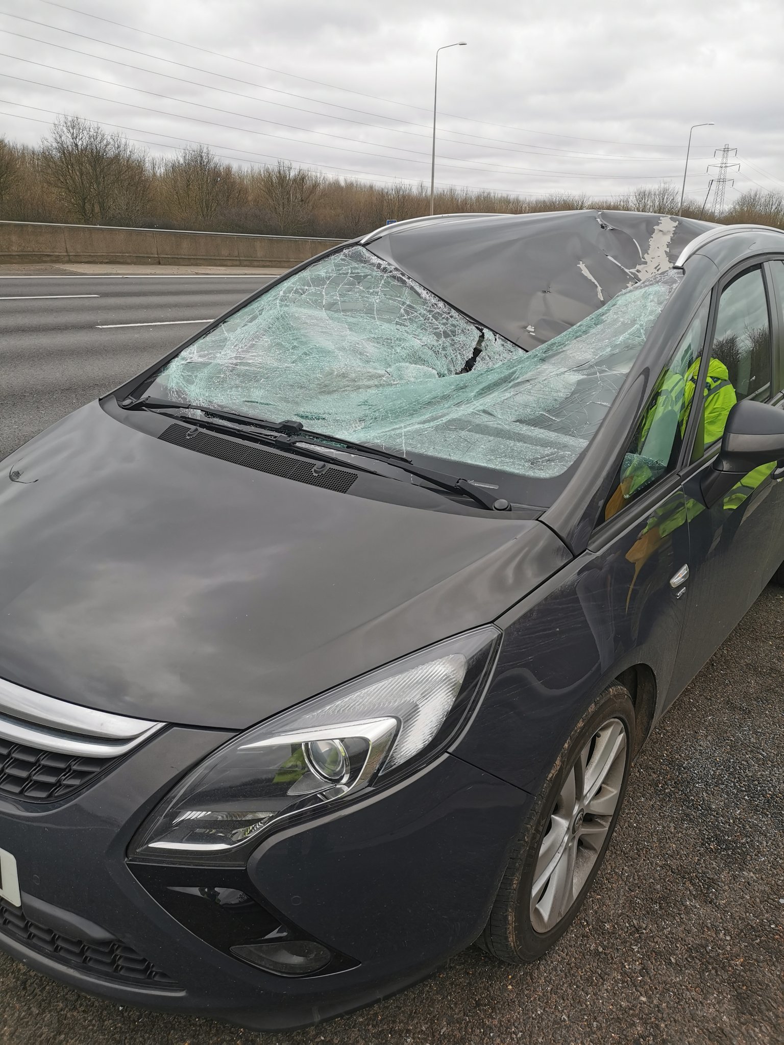 This Vauxhall Zafira was struck by a tyre which fell off a box van travelling in the other direction on the M25. Credit: BCH Road Policing Unit
