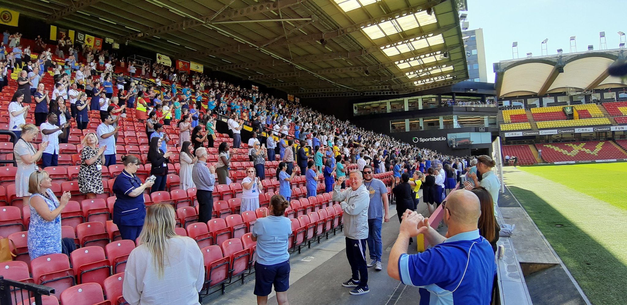 Hospital staff at Vicarage Road stadium in the spring. Credit: Anthony Matthews