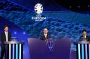 UEFA deputy general secretary Giorgio Marchetti, centre, had to address an unscheduled interruption to the Euro 2024 draw (Adam Davy/PA)