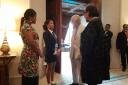 13-year-old Kenyan ambassador Ellyanne Wanjiku Chlystun meets the King at Cop28 (PA)