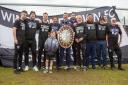 Tim Sills with his coaching staff after winning the title with Wimborne