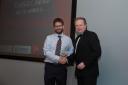 Luke Godfrey being presented with the sustainability award by Cllr Beric Read