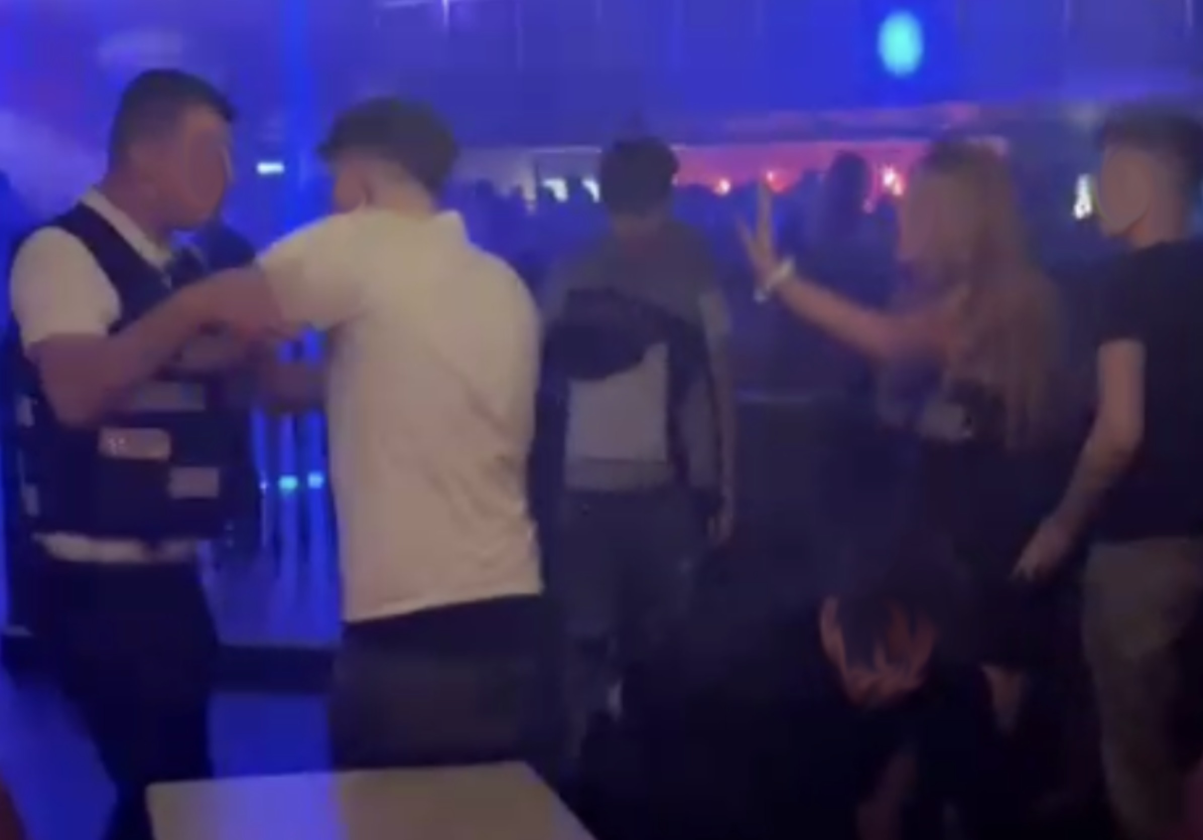 Screengrabs of footage in the club, as security interfered
