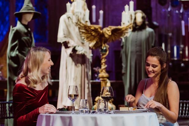 St Albans & Harpenden Review: A couple enjoying a valentine's dinner in the Great Hall. Credit: Warner Bros. Studio Tour London – The Making of Harry Potter.