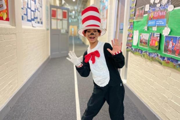 A student at Cheam Common Junior Academy in Surrey dressed as The Cat in the Hat (PA)