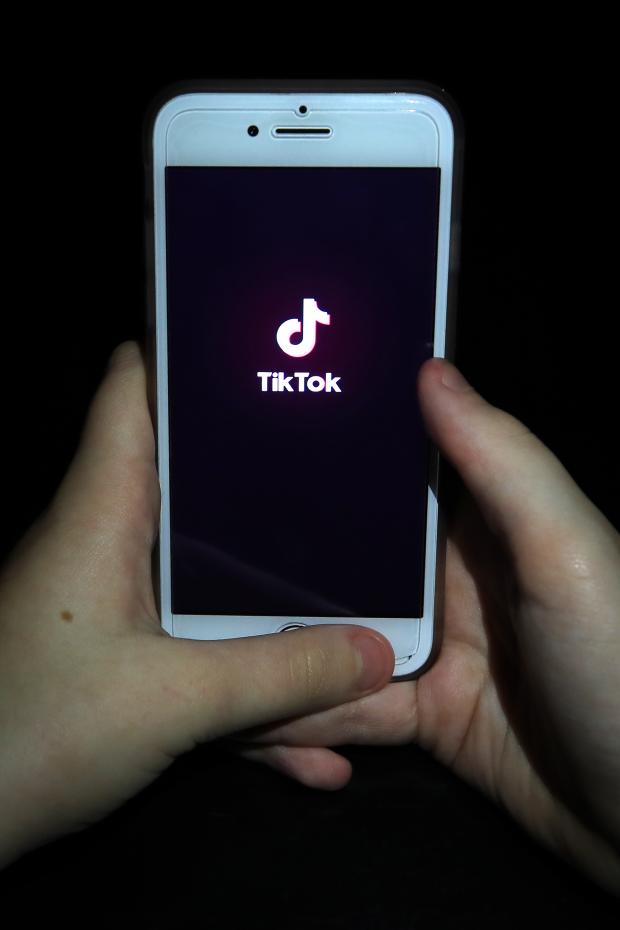 St Albans & Harpenden Review: A person with TikTok open on their phone. Credit: PA