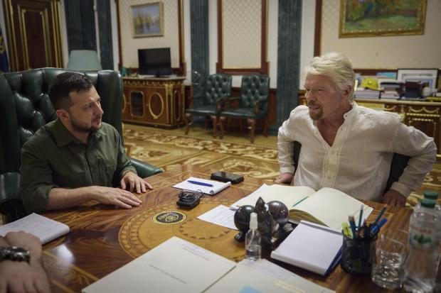 Handout photo issued by Ukrainian Presidential Press Office of Ukrainian President Volodymyr Zelensky during his meeting with Sir Richard Branson in Kyiv, Ukraine, on Wednesday, June 30 2022