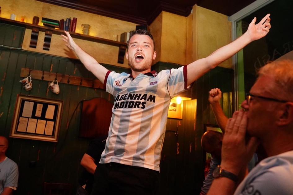 Celebrating West Ham fans dance on tables after European final win